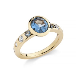18k gold ring with diamonds, and blue spinels