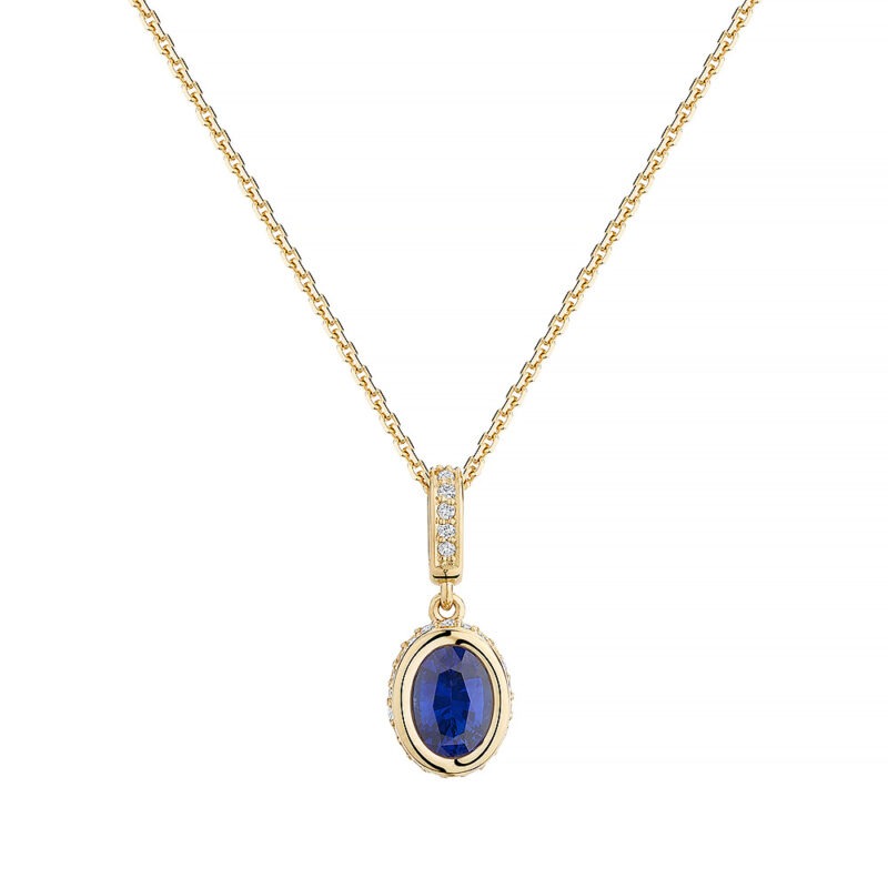 18k yellow gold pendant set with a royal blue oval sapphire, and diamonds