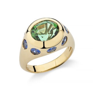 18k gold ring set with a green tourmaline and accented by sapphires